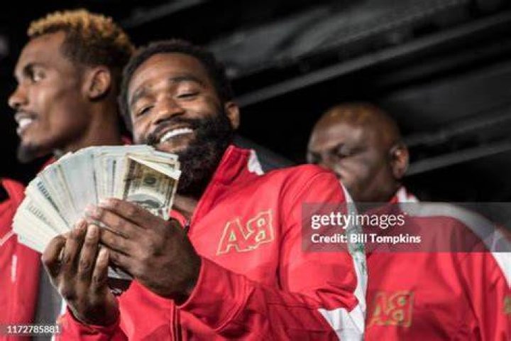 Adrien Broner flashing money during the Adrien Broner vs Mikey Garcia Final Press Conference at the Dream Hotel July 27, 2017 in New York City.