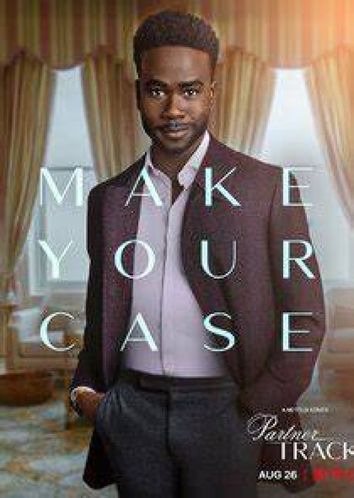 Bradley Gibson as Tyler Robinson, looking out a window while in his office and wearing a suit in episode 1 of Netflix series Partner Track Bradley Gibson as Tyler Robinson, looking out a window while in his office and wearing a suit in episode 1 of Netflix series Partner Track