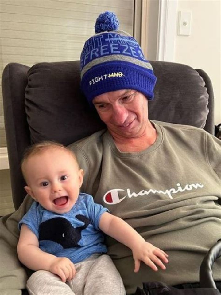 Chris and his grandson visiting a farm. Source: Chris's Twitter