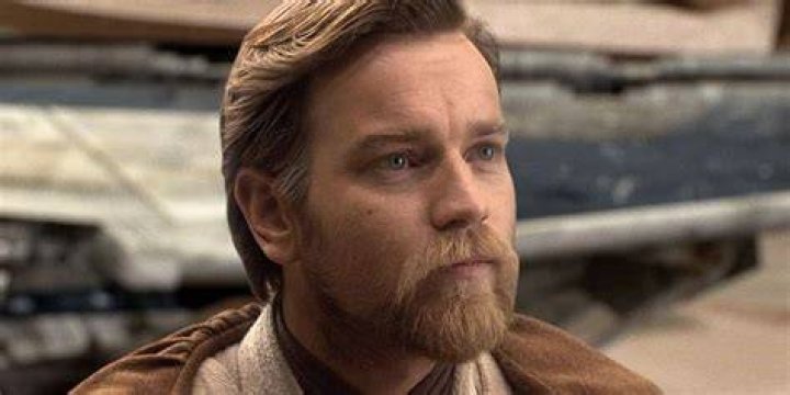 Ewan McGregor is staring at something in the distance.