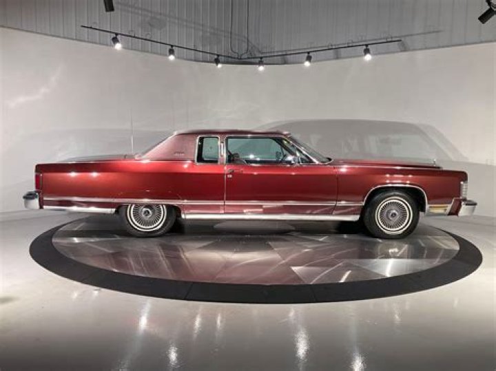 Levy with 1977 Lincoln Continental Sedan. Levy with 1977 Lincoln Continental Sedan.
